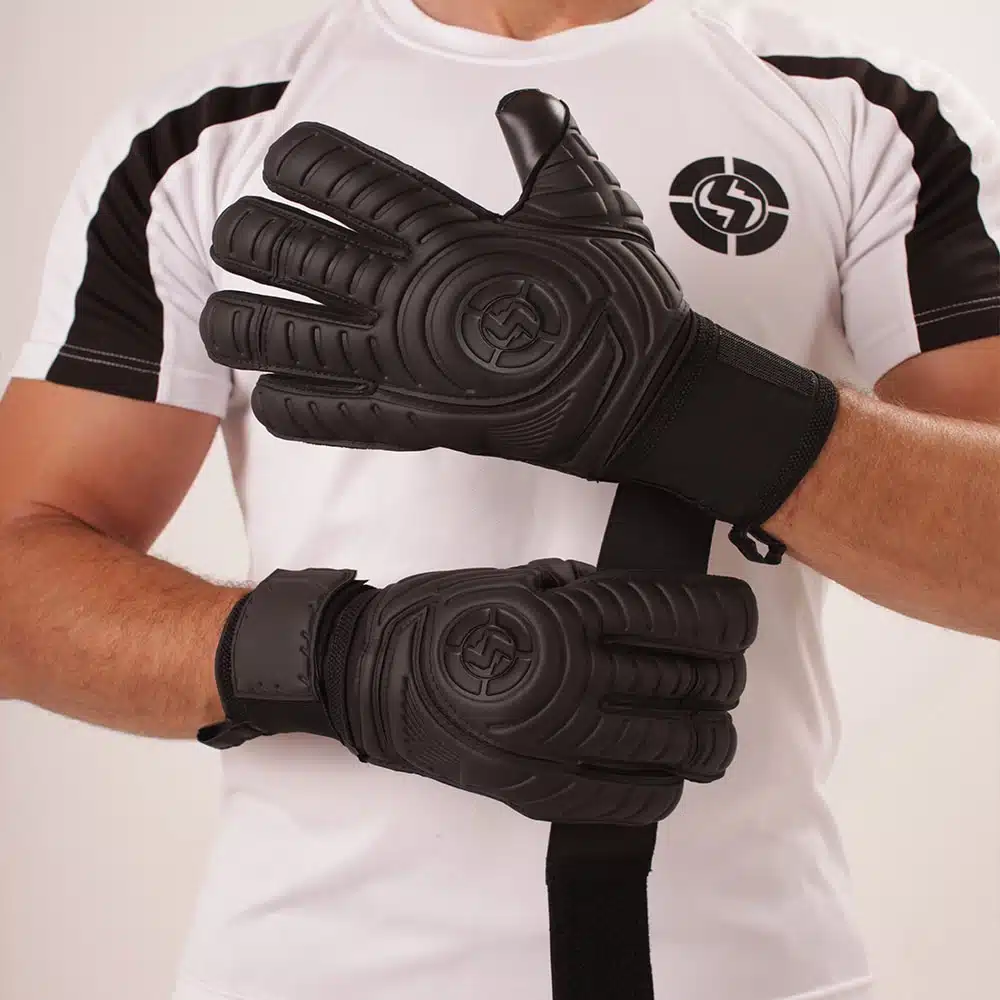 Goalkeeper wearing black goal keeper gloves during training session.