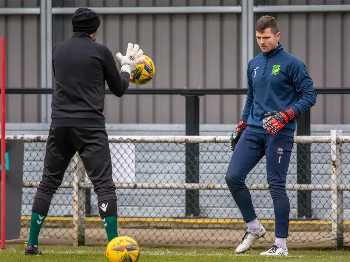 The Modern goalkeeper in action, showcasing skills like ball handling and quick reflexes on the soccer field.
