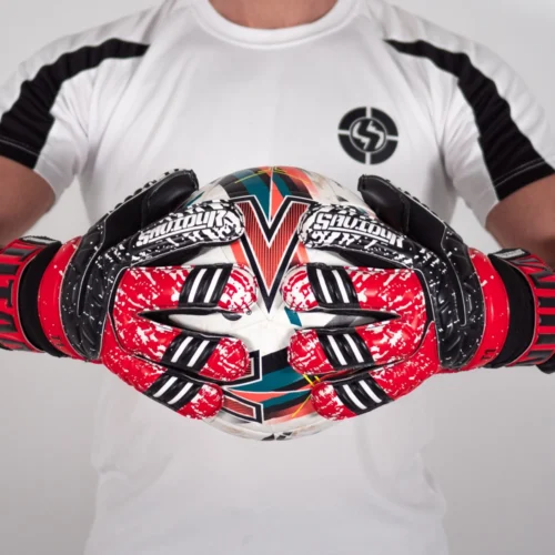 Youth-focused negative hybrid cut finger saver goalie gloves in dynamic red with black detailing, providing enhanced finger safety.