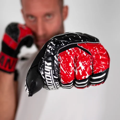Professional-grade red and black goalkeeper gloves with negative hybrid cut, perfect for top-level play.