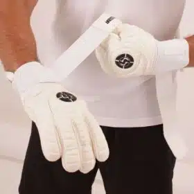 Pro adult soccer gloves leaping to save a goal with Saviour Classic V1 roll finger goalkeeper gloves.