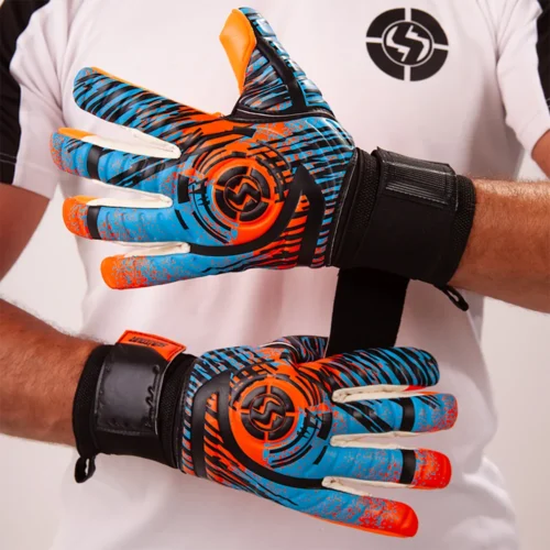 Elite soccer goalie diving to save a ball with high-tech elite soccer goalie gloves.