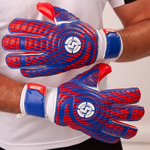 Goalkeeper confidently catching the ball using high-quality good keeper gloves.