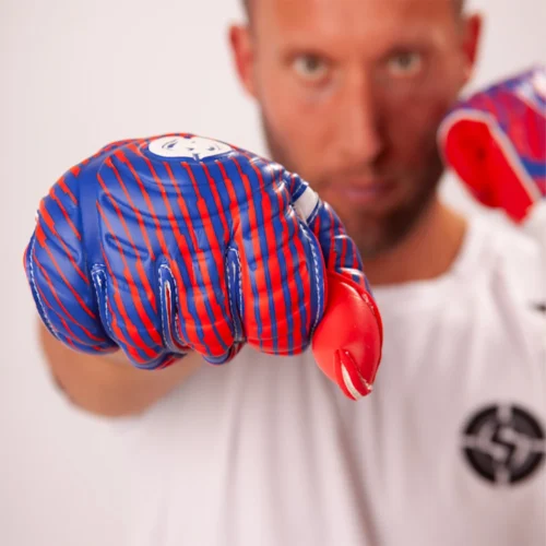 Goalkeeper wearing classic retro goalkeeper gloves, preparing for a save.