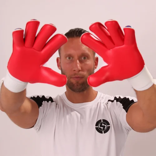 Goalkeeper showcasing the superior grip of sticky goalkeeper gloves latex during a match
