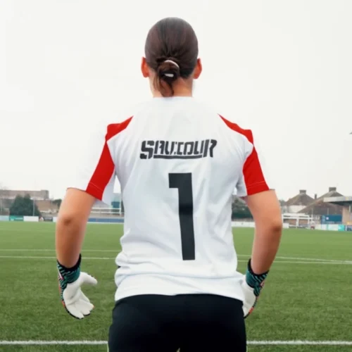Goalkeeper training in a breathable white goalkeeping t-shirt.