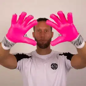 Close-up of EVO-POS+ palm and finger spines on pink and blue junior goalie gloves