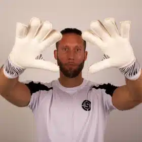 Youth goalkeeper gloves with finger guards and flat hybrid design in Vortex style.