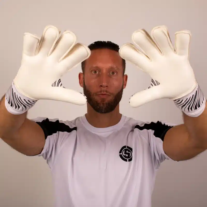 Youth goalkeeper gloves with finger guards and flat hybrid design in Vortex style.