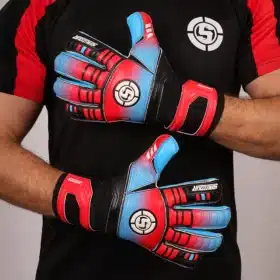 Durable blue and red soccer goalkeeper gloves for youth players.
