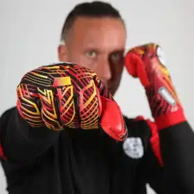 Hands wearing Adult Removable Strapless Goalkeeper Gloves, demonstrating the tight negative cut fit and flexibility.