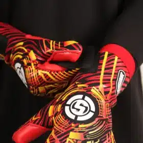 Goalkeeper wearing Adult Removable Strapless Goalkeeper Gloves, highlighting the reinforced latex palm and secure wrist fit.